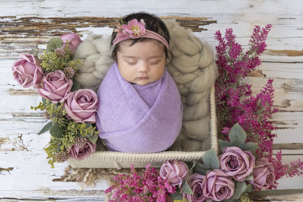 Newborn baby swaddled for a studio portrait at Nook Look, Coquitlam
