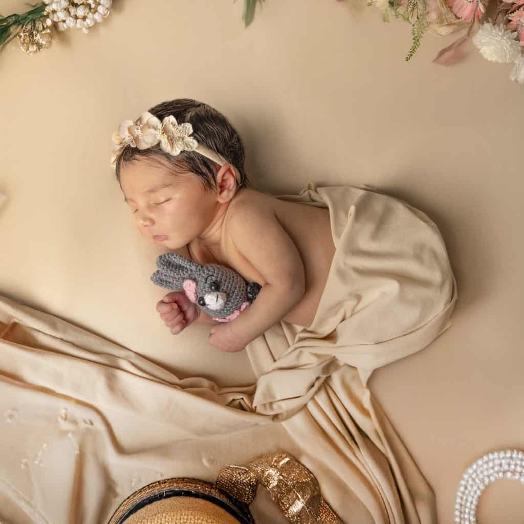 Newborn baby sleeping during a studio photography session at Nook Look, Coquitlam