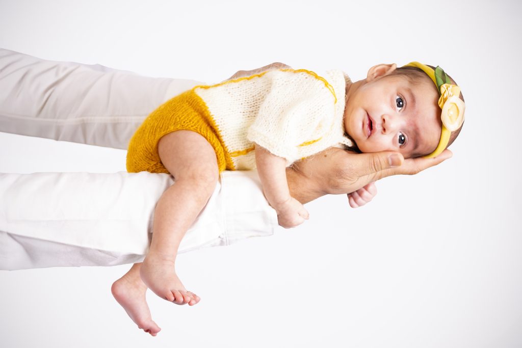 Newborn baby wrapped and posed for a portrait at Nook Look studio, Coquitlam